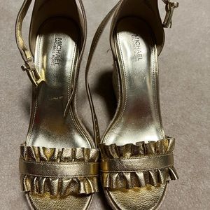 Authentic-Michael Kors leather sandals detailed with a ruffled front bar,